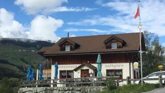 Pignia village with the Caltgera restaurant in summer