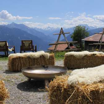 The terrace of the Parsiras mountain inn in summer