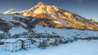 Splügen village in winter at sunset