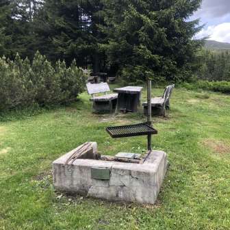 Fireplace with barbecue grill at Bruchalp Tschappina