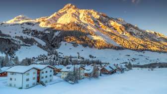 Splügen village in winter at sunset