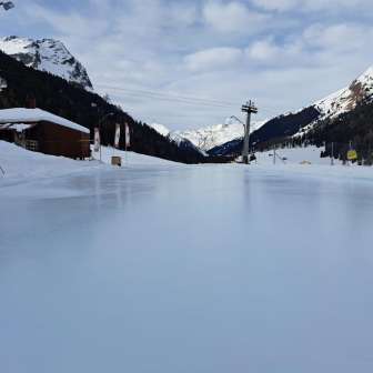 The natural curling ice rink at the Hüschera Bar and Lodge