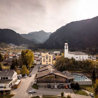 Andeer with mineral baths and reformed church in the fall