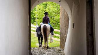 Riding through Splügen on Icelandic horses
