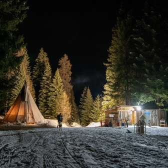 The tipi and toboggan bar on the Schamserberg in the evening